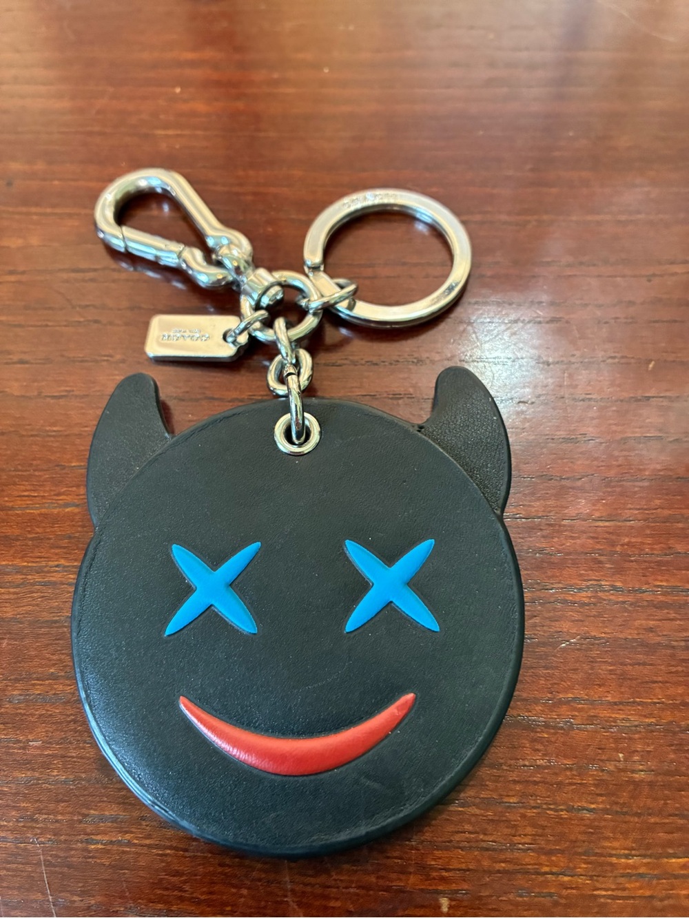 Coach Black Devil Face Keychain with Blue Eyes and Red Smile